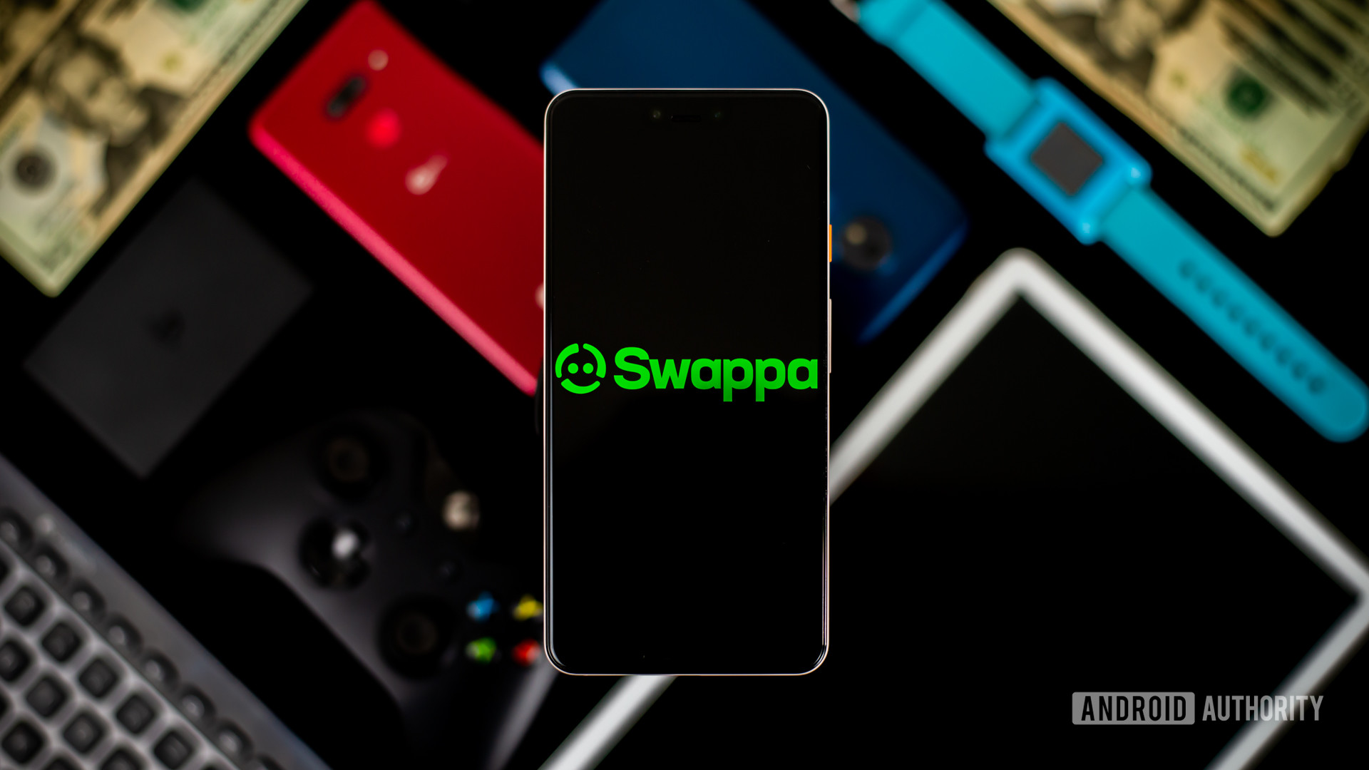 Swappa徽标在智能手机上带有背景库存设备的设备 - 出售手机