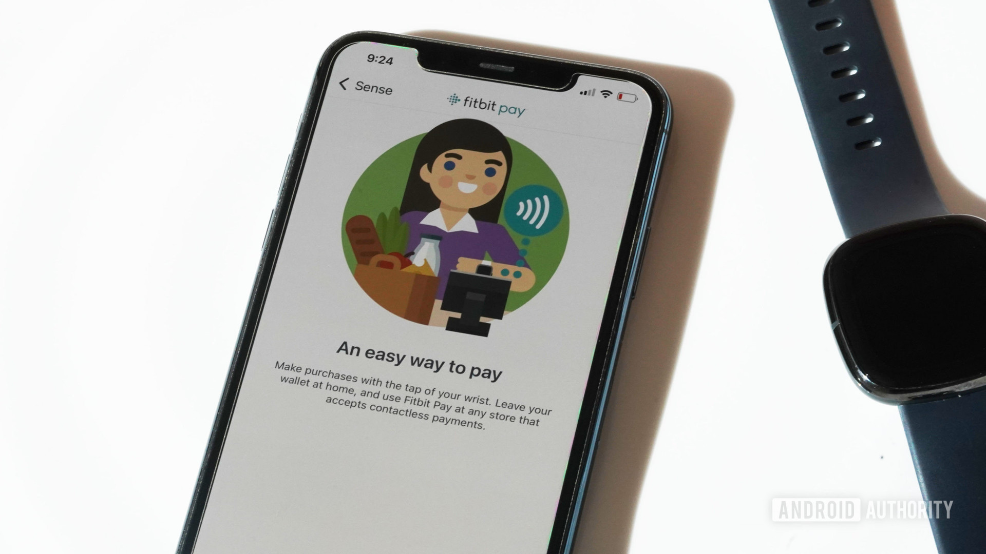 iPhone 11在Fitbit应用程序中显示了Fitbit Pay屏幕，以及Fitbit Sense。